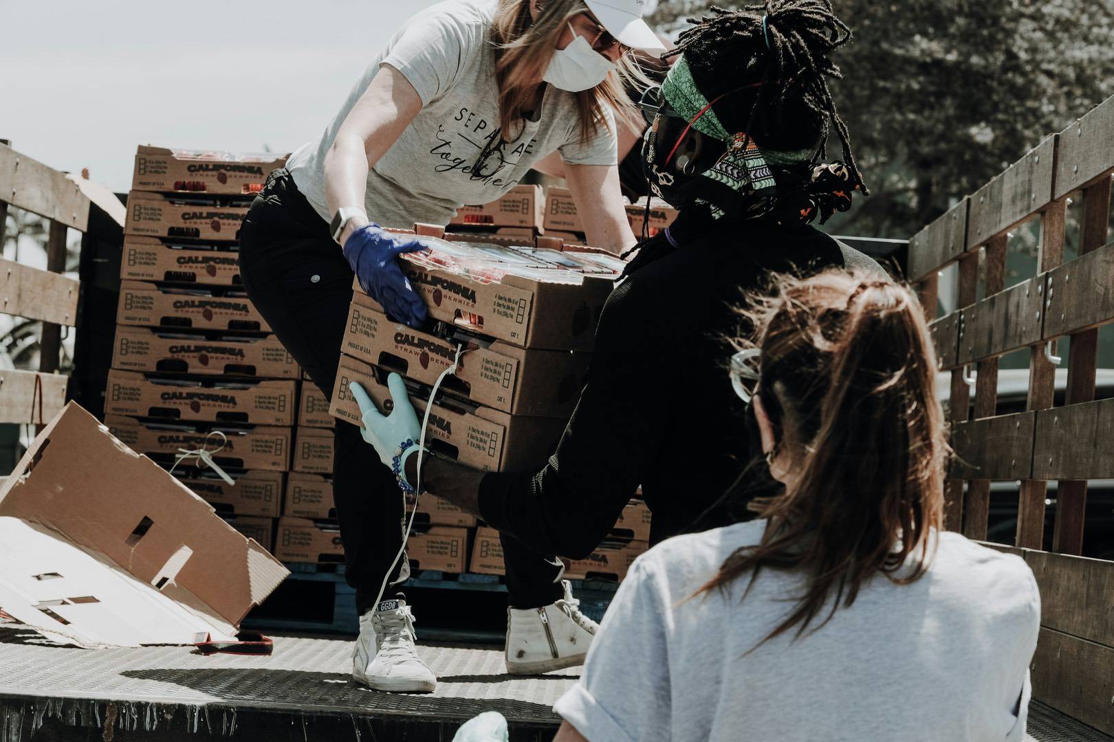 Image of volunteers transporting food to food banks